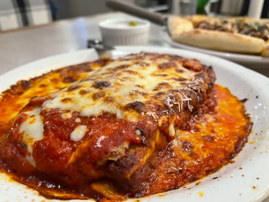 Close-up of lasagna showing the ragu sauce