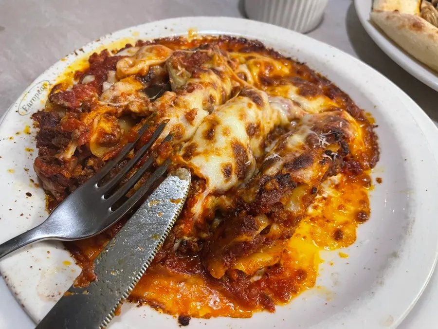 Cross-section of lasagna with a bite taken out