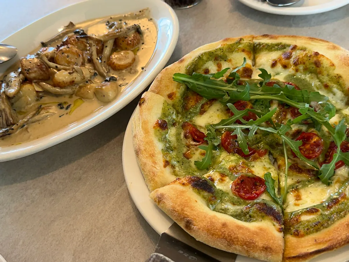 Basil margherita pizza and truffle mushroom cream gnocchi served together