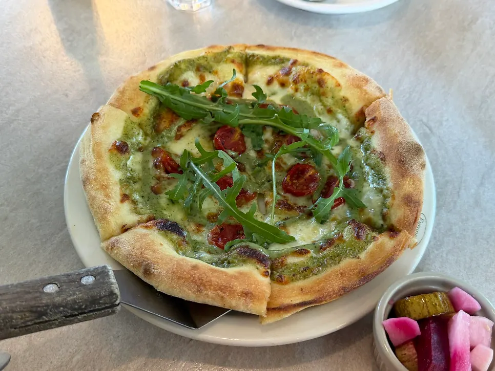 Margherita pizza topped with basil