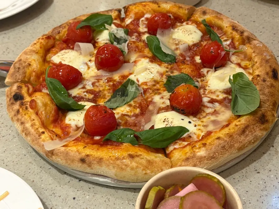 Tomato, cheese, and basil Margherita pizza