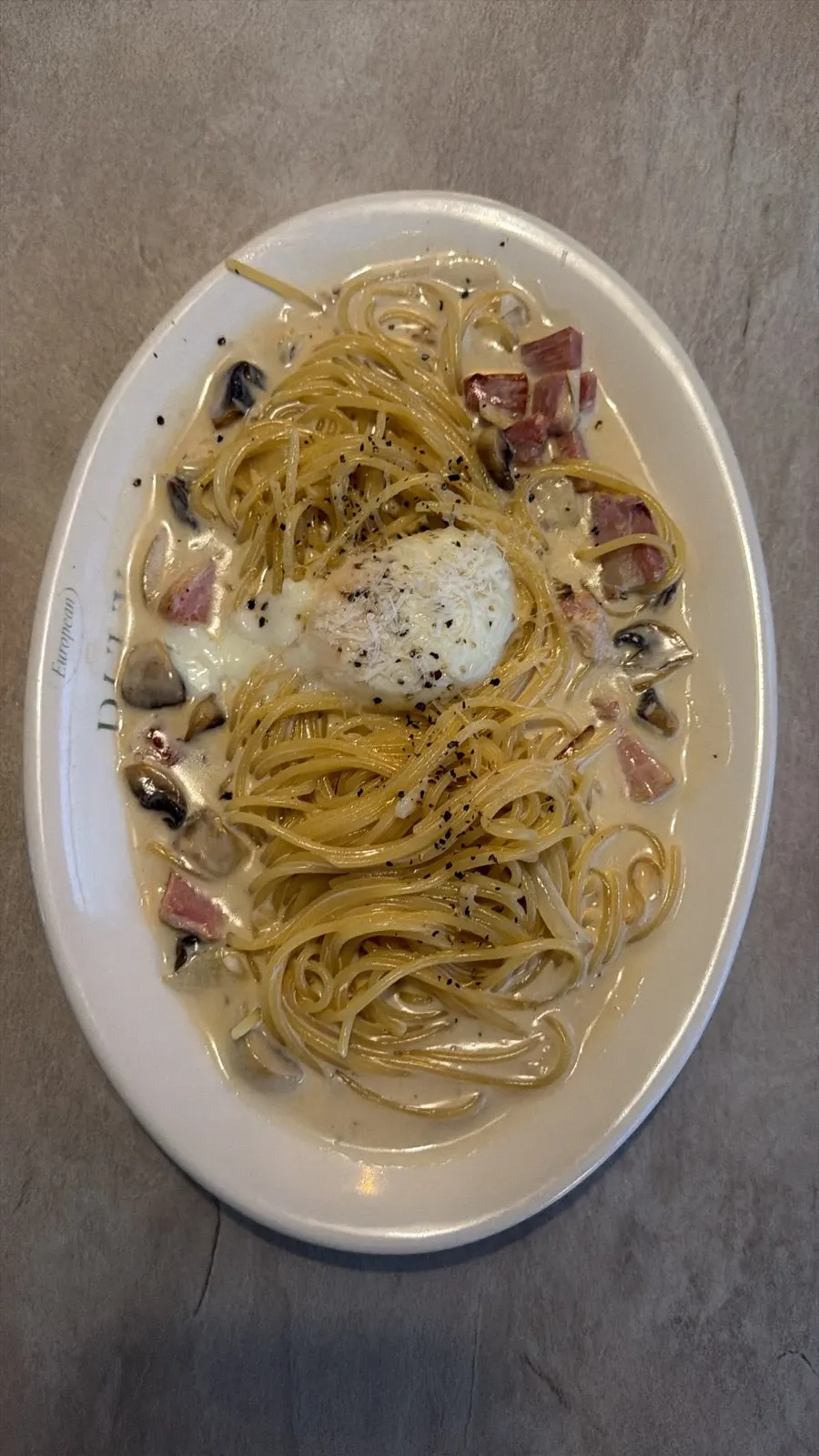 Carbonara topped with a poached egg