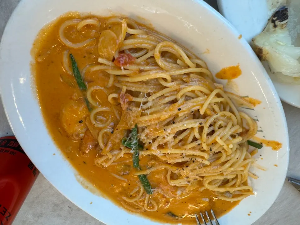 A plate of pasta eaten alongside the risotto