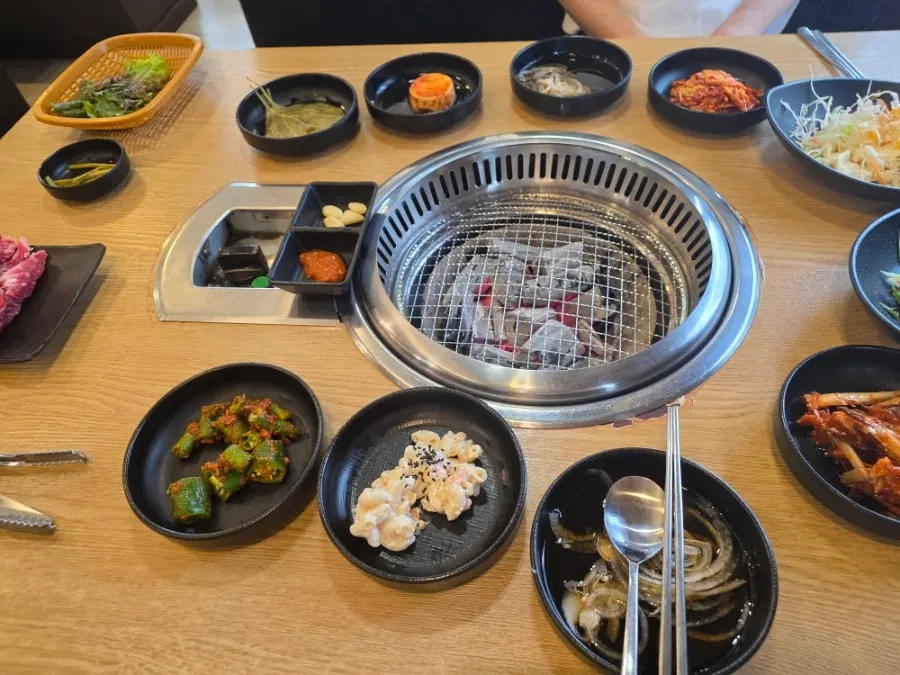 Galbi restaurant table setting with side dishes