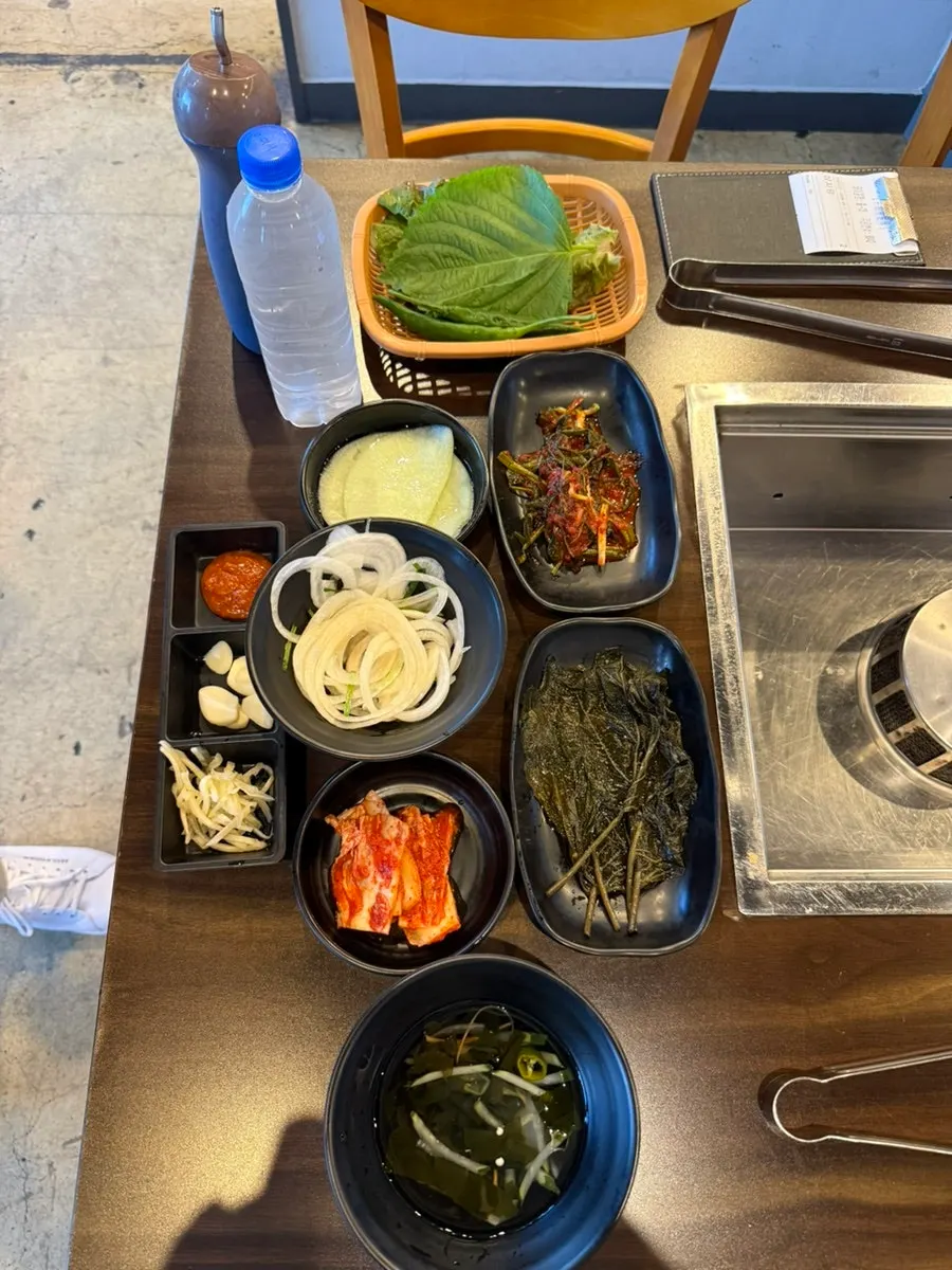 Yuil Jangeo's basic table setting with scallion kimchi and wrap vegetables