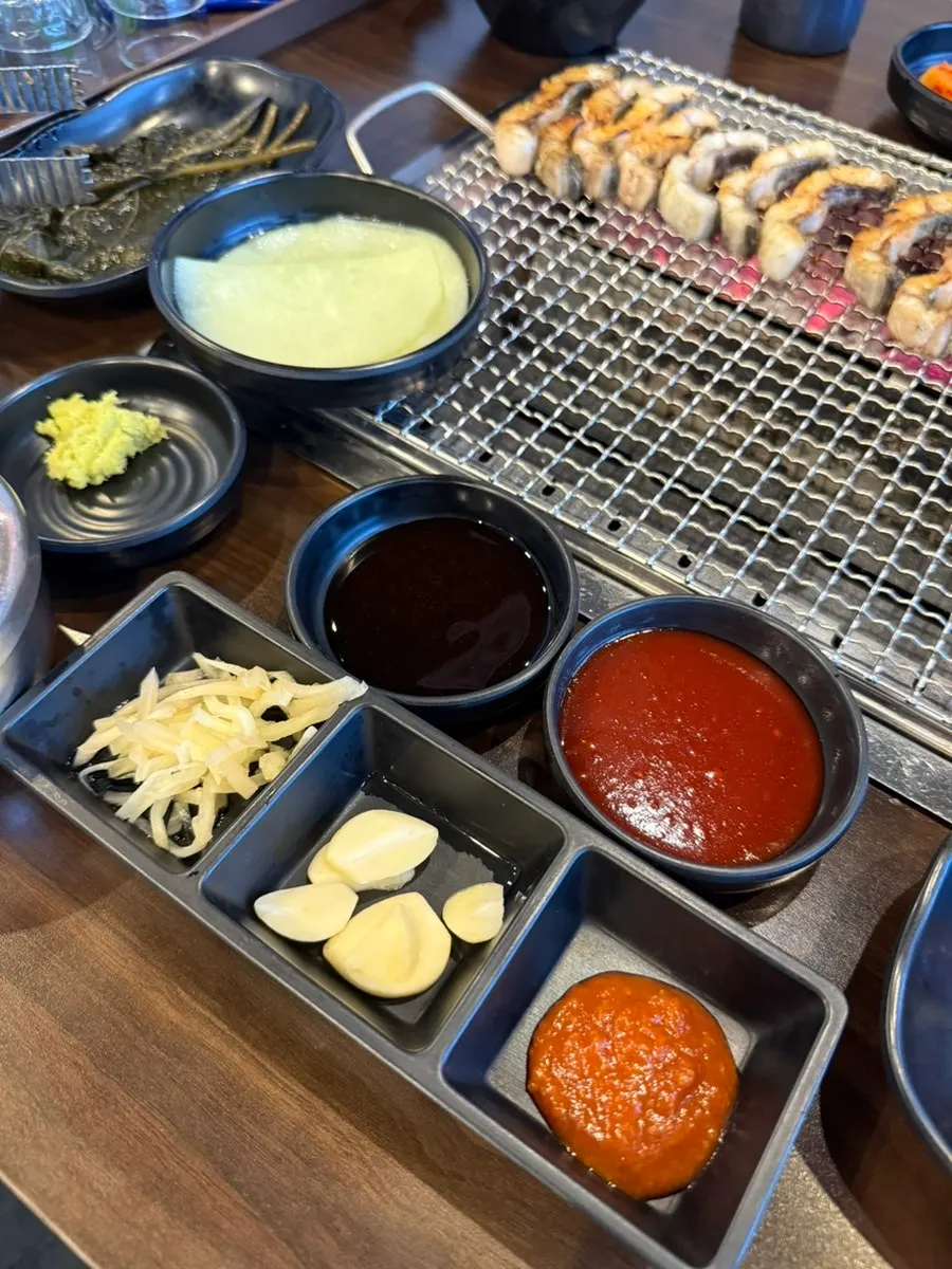 Side dishes including cold cucumber soup and pickled onion