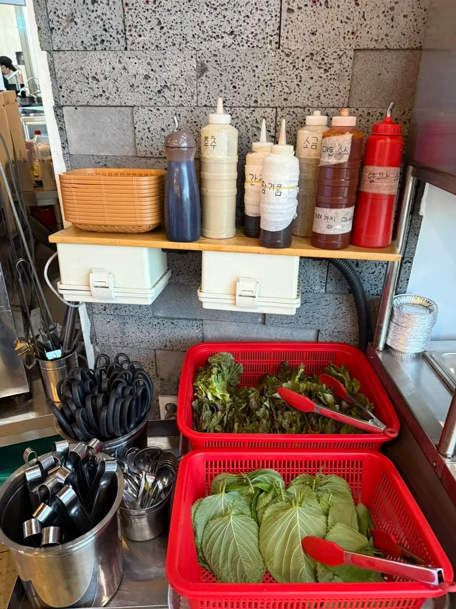 Various sauces set out at the self-serve bar