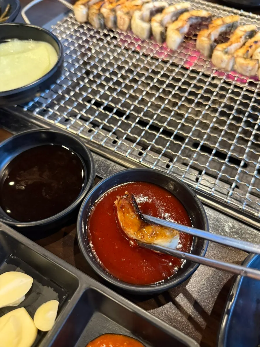 Eel grilling to a golden brown on the grill plate