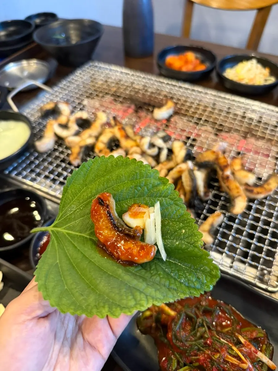 A plate still heaped with grilled eel