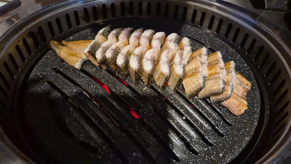 Close-up of charred eel skin