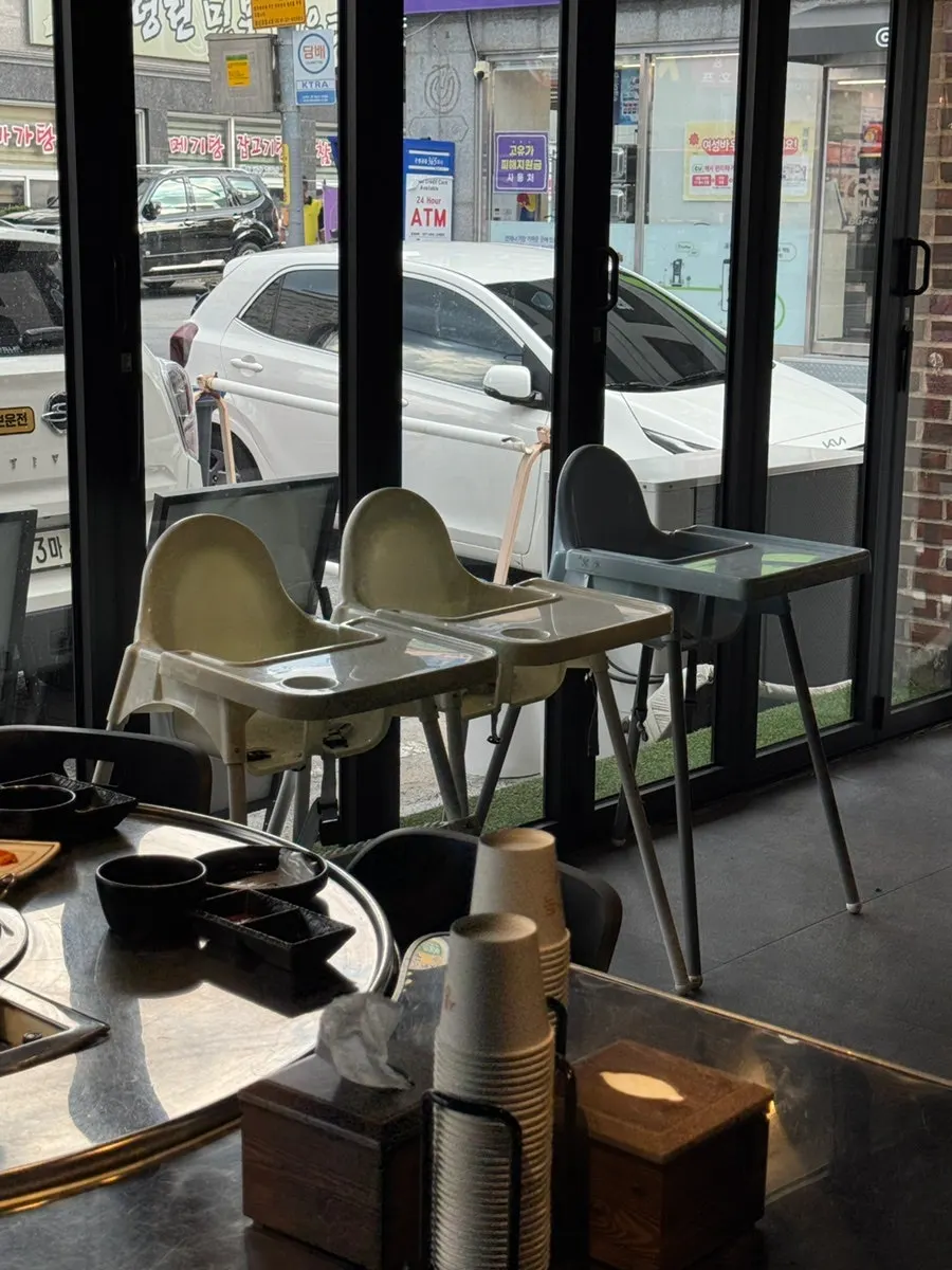High chair placed in a corner of the restaurant