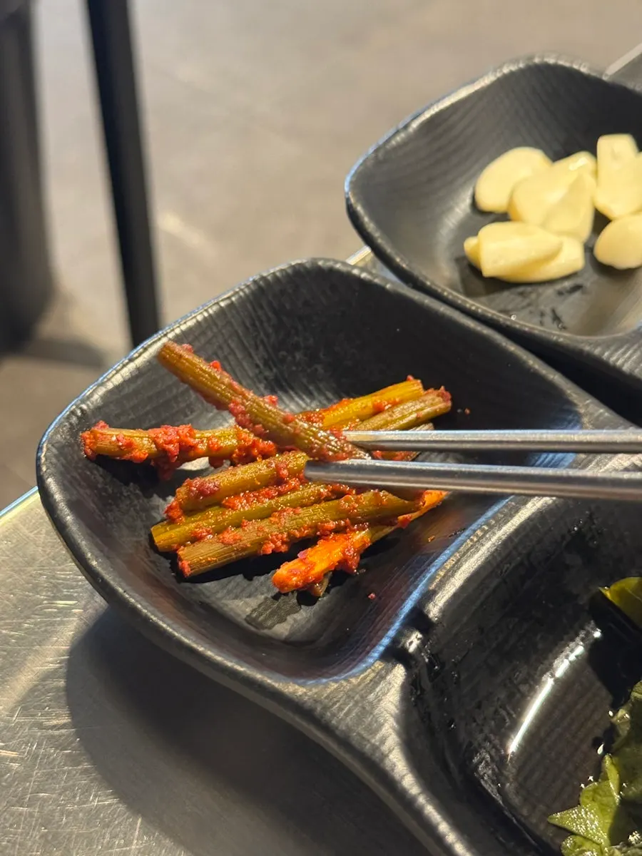 Garlic stems in red seasoning served as a side dish