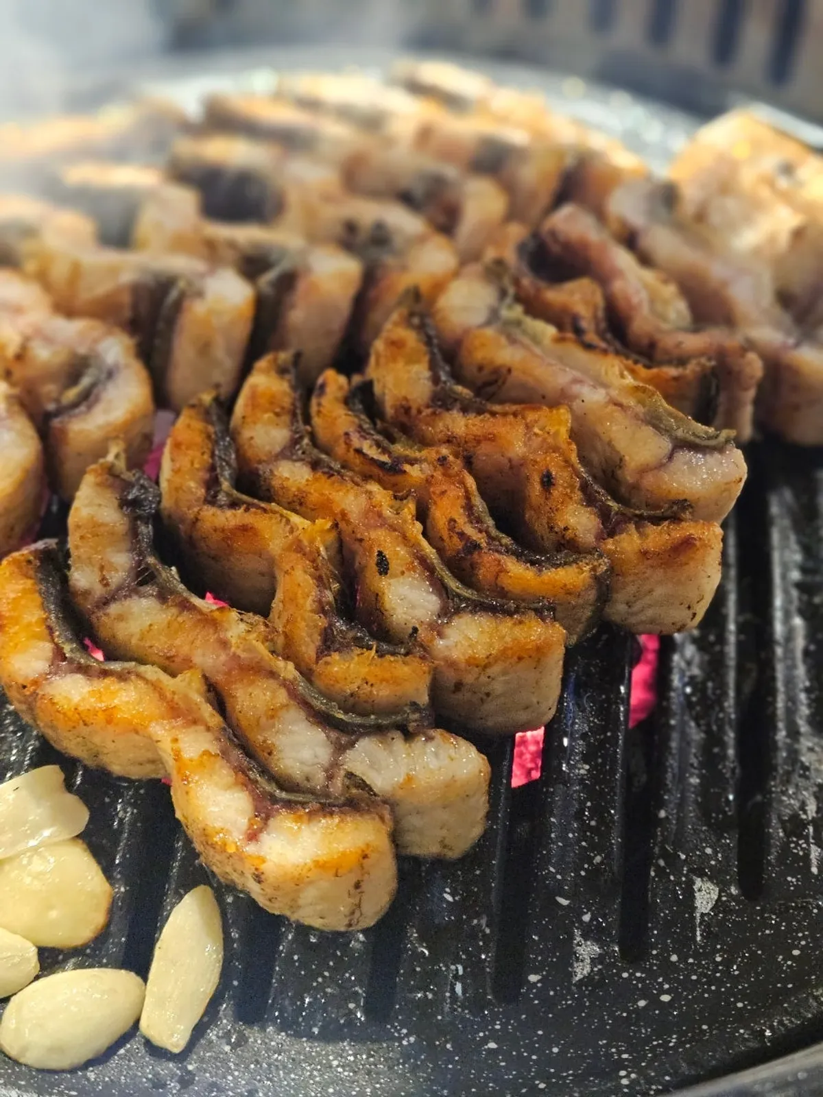 Fully cooked grilled eel from Ppaksen Freshwater Eel over charcoal