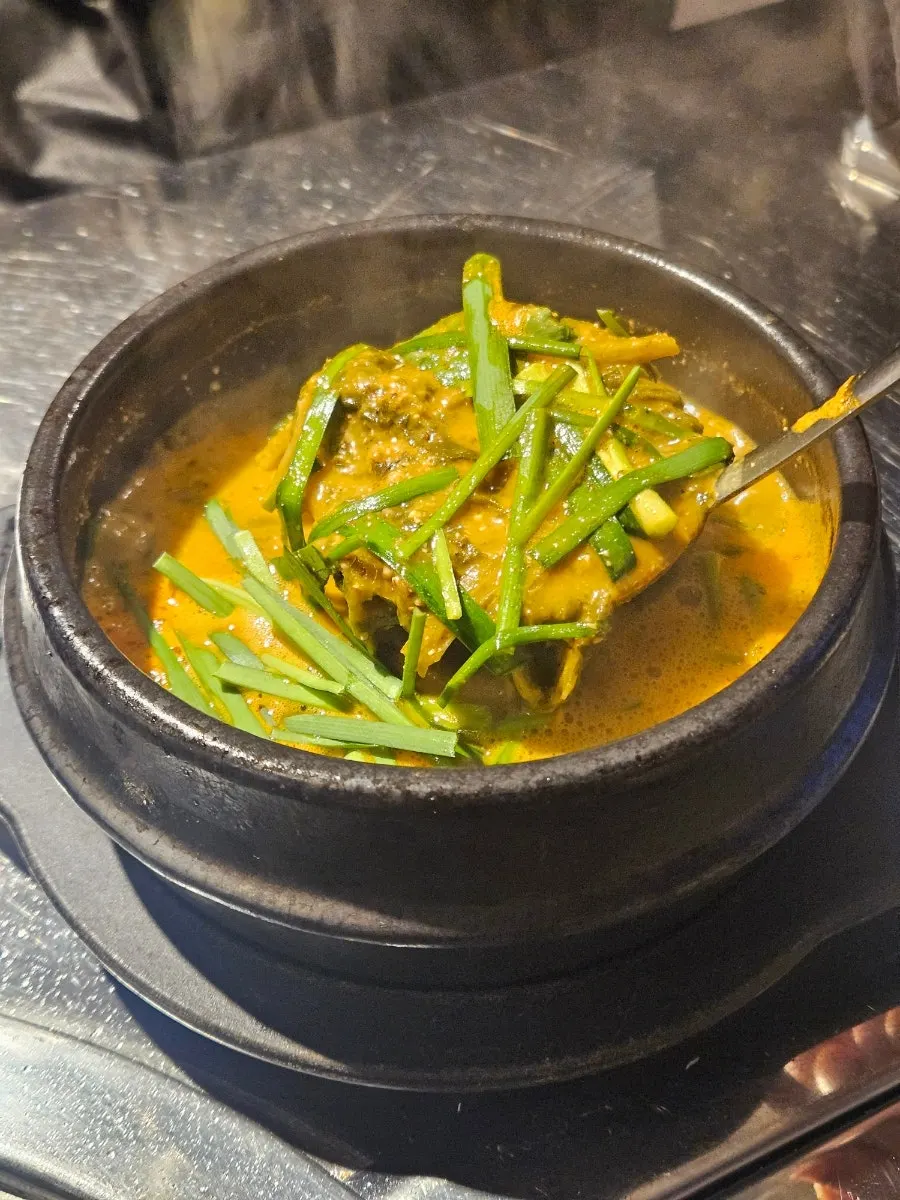 Eel soup served bubbling in a stone pot