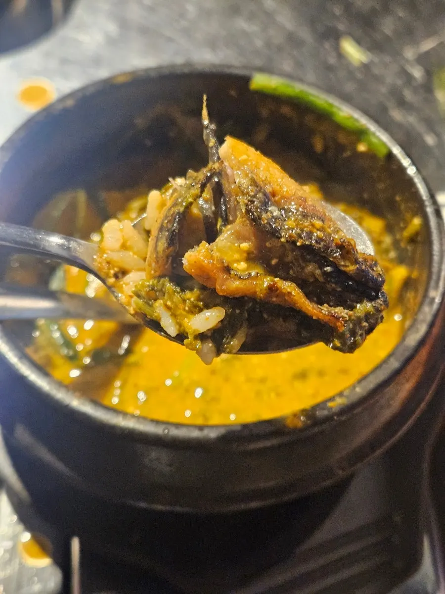 Leftover grilled eel dipped into the eel soup broth