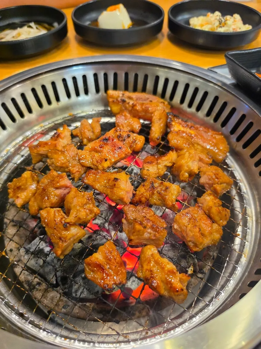 Marinated pork ribs browning on the grill