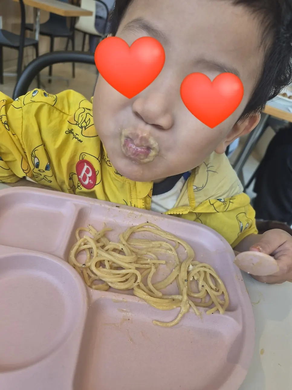 Carbonara pasta topped with an egg yolk