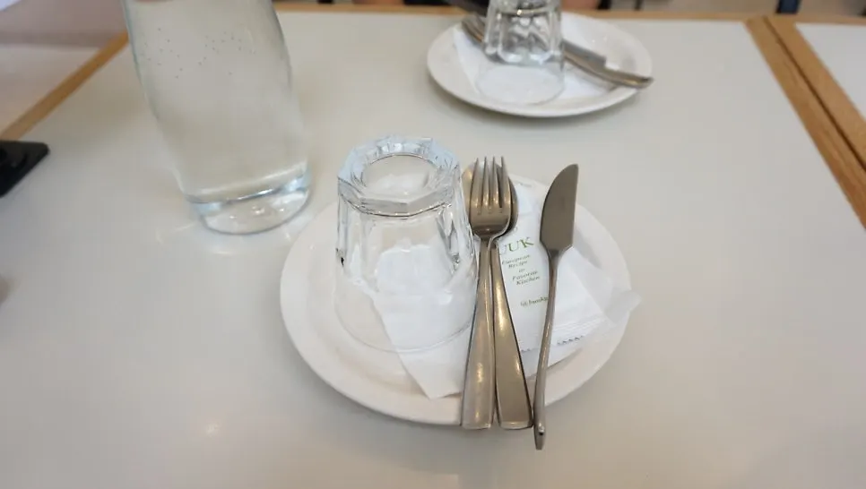 Waiting at the table for the two ordered pizzas
