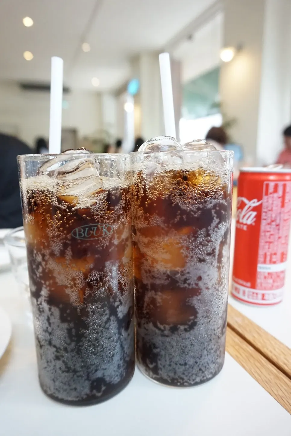Coke served alongside the pizza