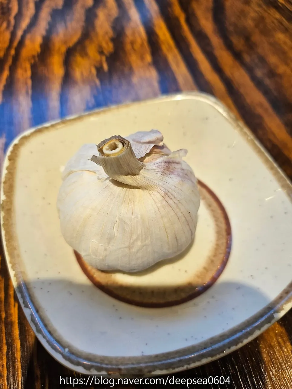 A plate of whole garlic served only when ordered separately