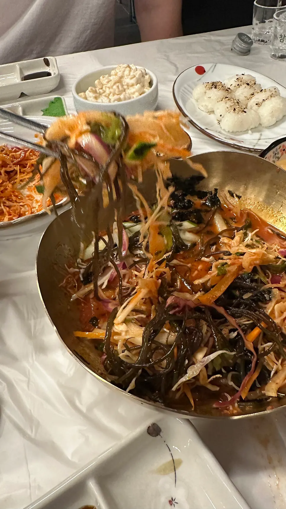 Complimentary sides with vinegared salad and saury