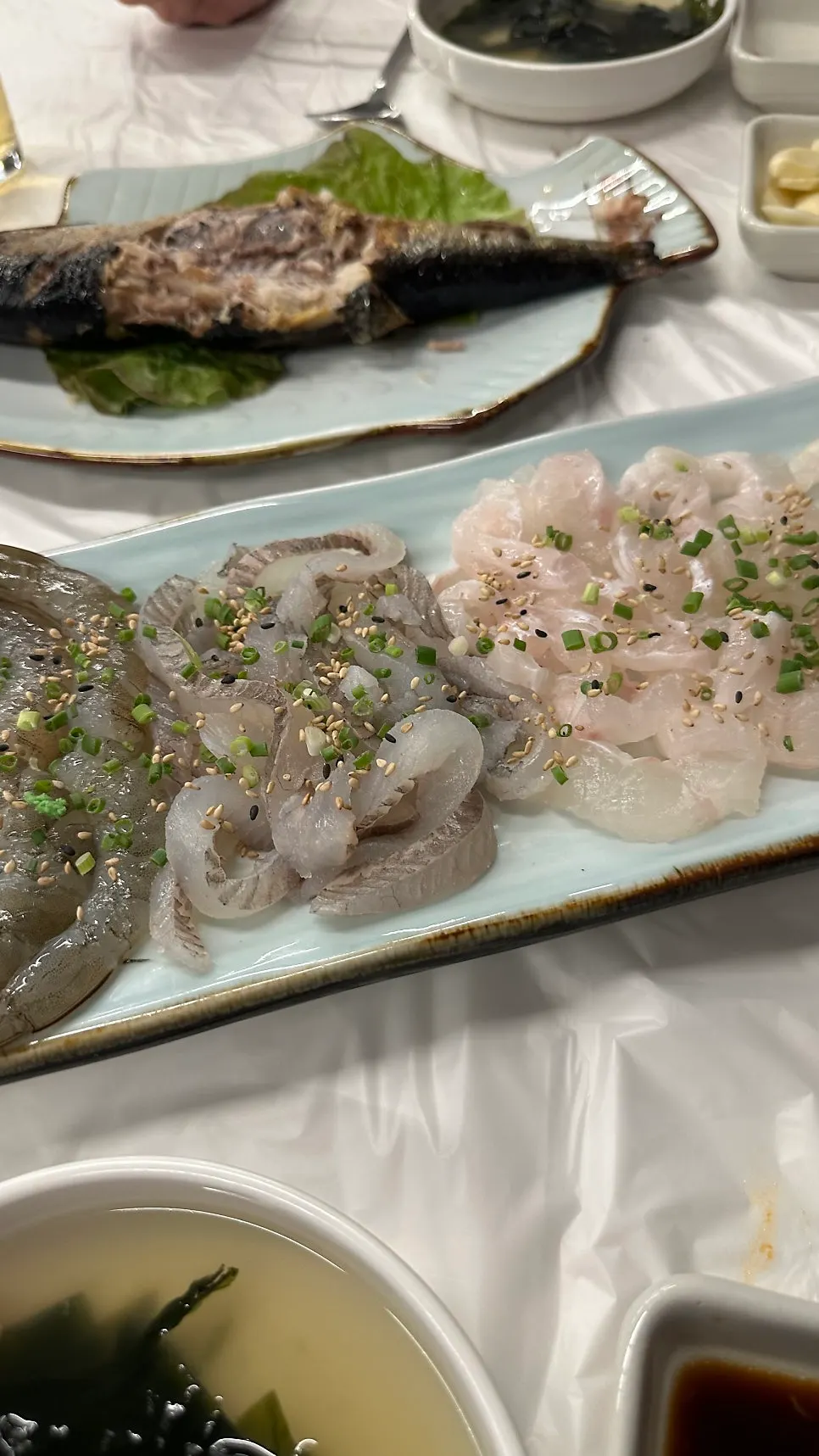 A plate of fresh live fish sashimi