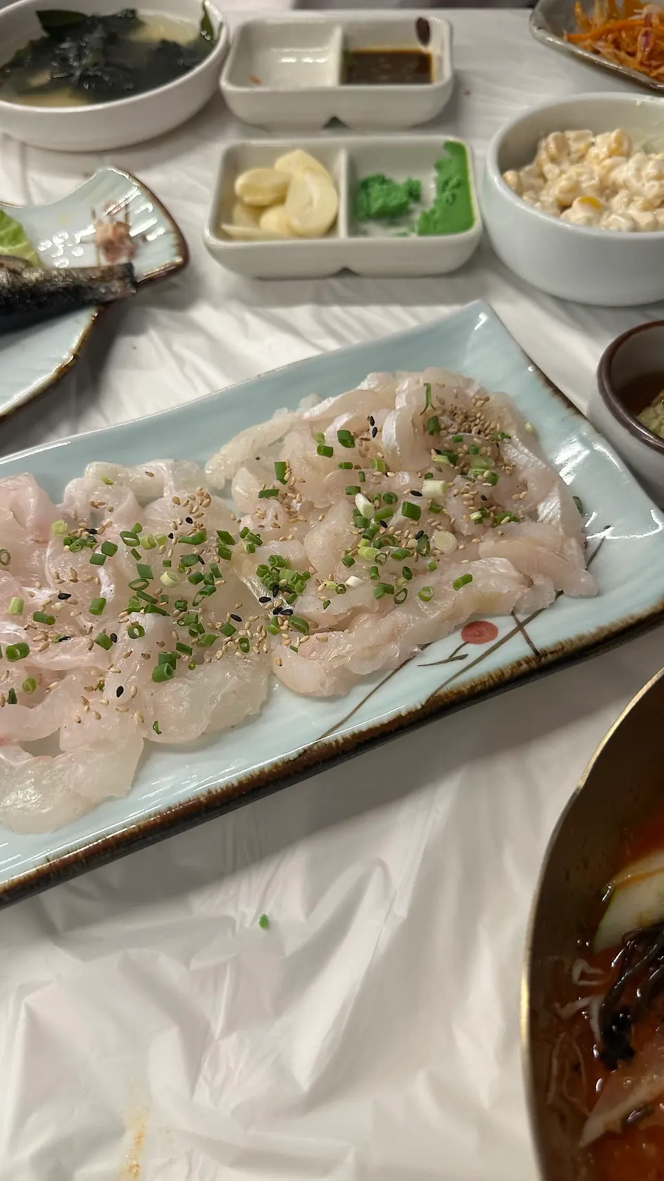 Thickly sliced live fish sashimi