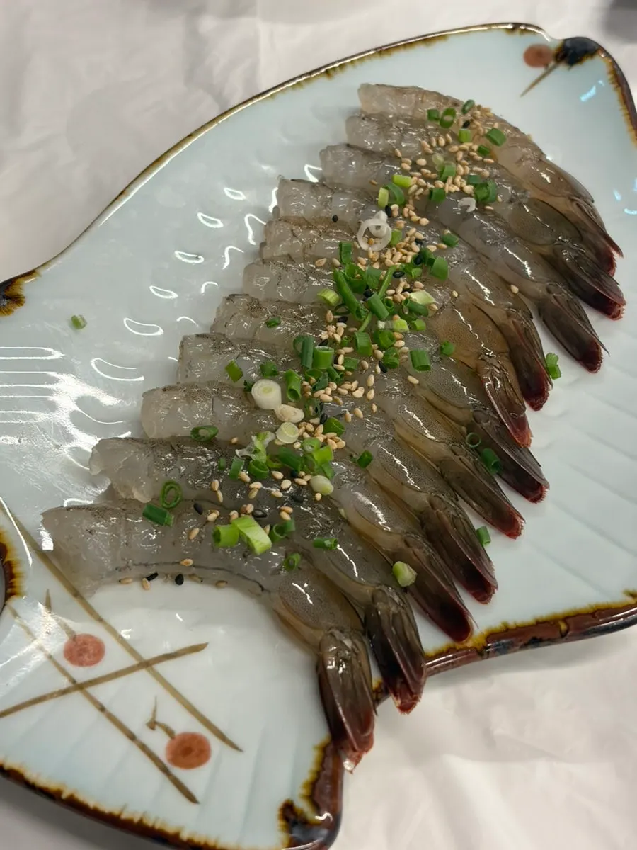 A bottle of soju with the basic side dishes