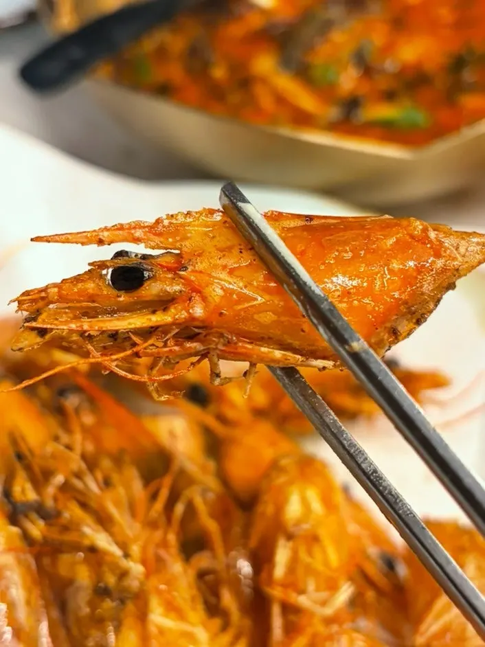 Butter-grilled shrimp heads served separately