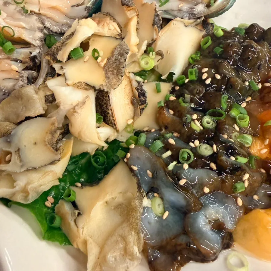 Mixed seafood platter with sea squirt, sea cucumber, whelk, and abalone