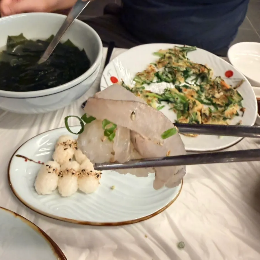 A piece of mixed sashimi eaten with various accompaniments