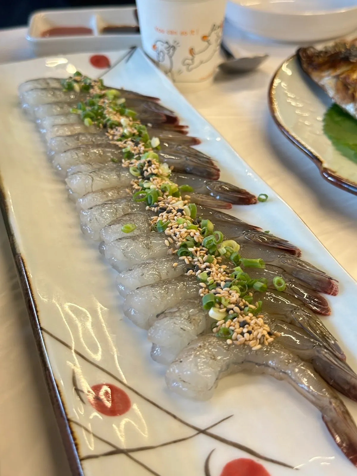 Close-up of translucent raw shrimp sashimi