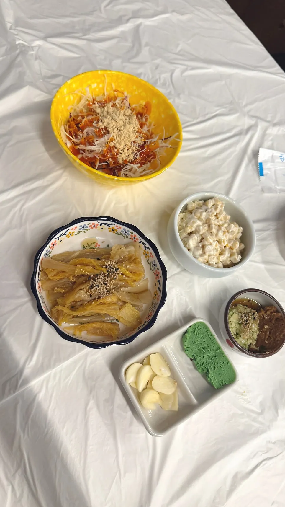 Base spread of salad, kimchi, and corn salad