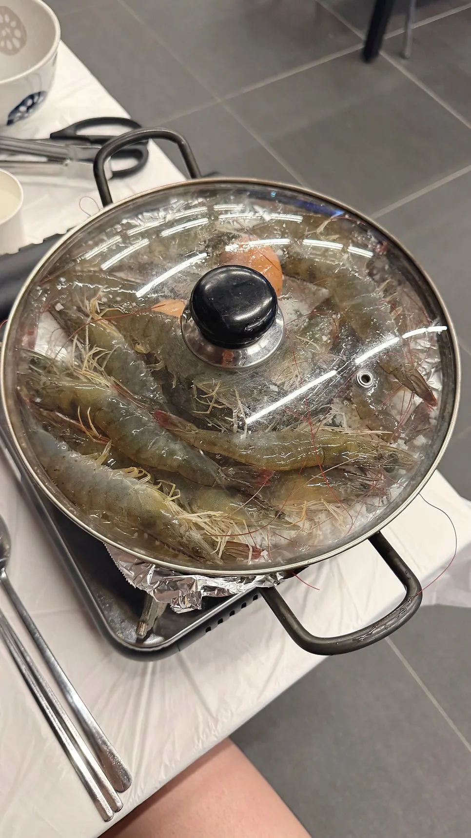 Raw shrimp placed on coarse salt