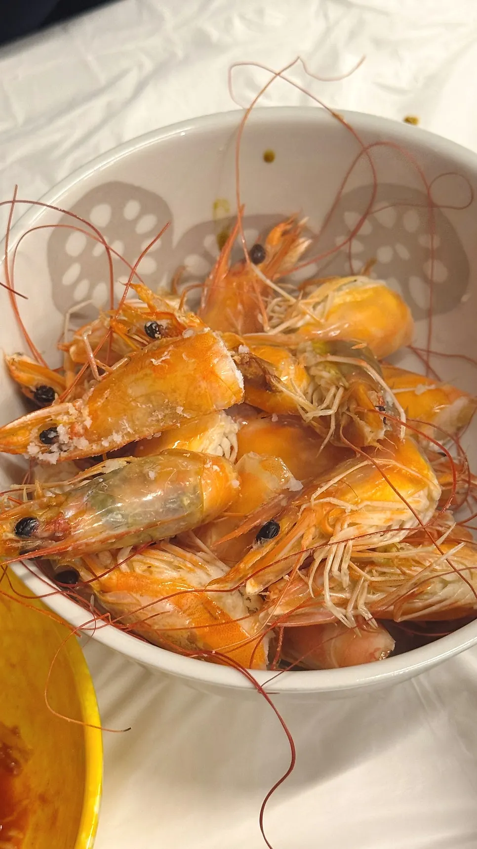Shrimp heads grilling in butter