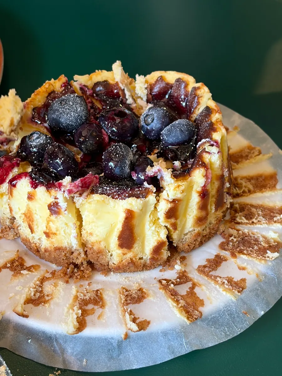 A slice of rich, dense blueberry cheesecake