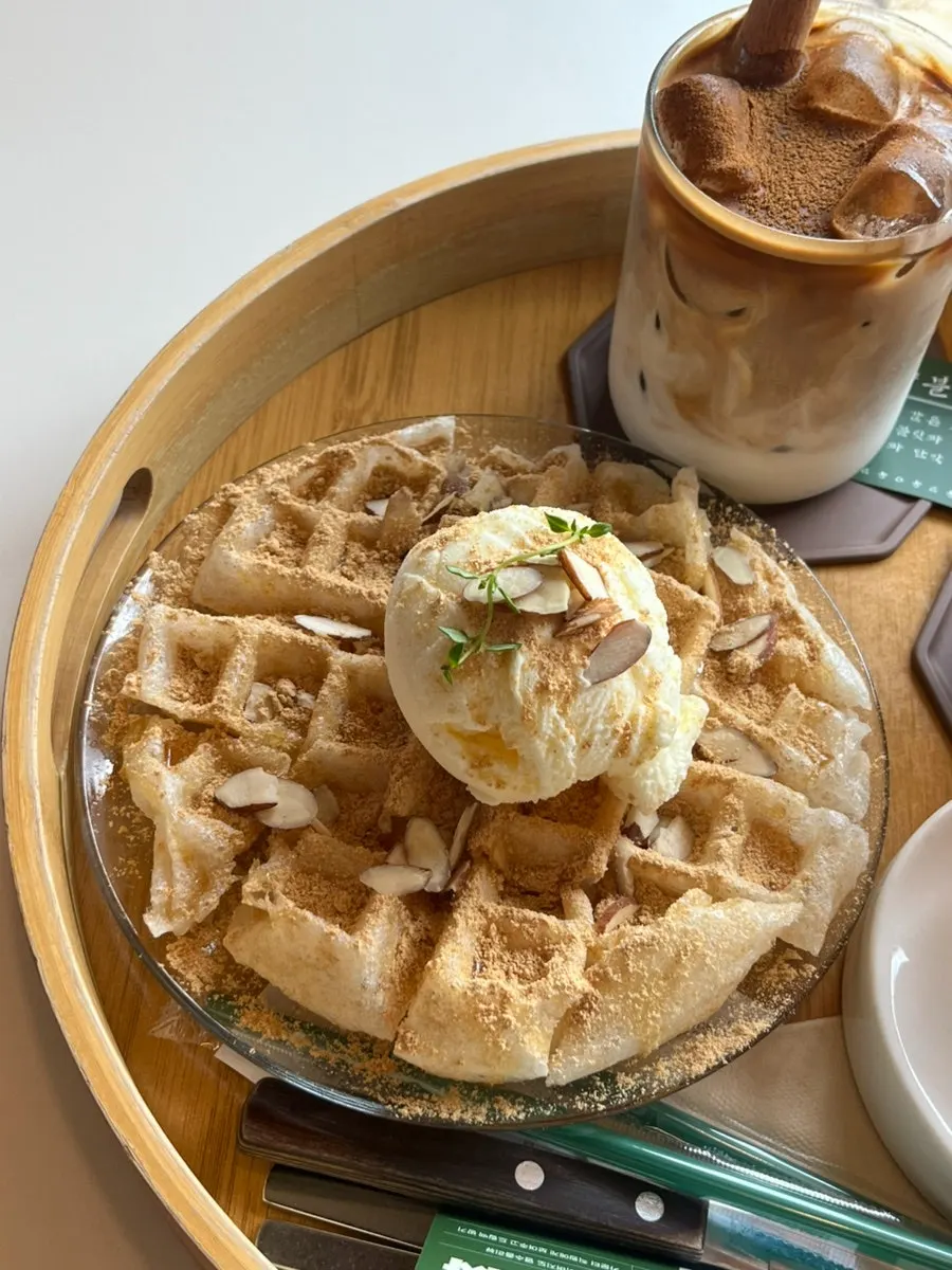 Injeolmi waffle topped with grain syrup and soybean powder