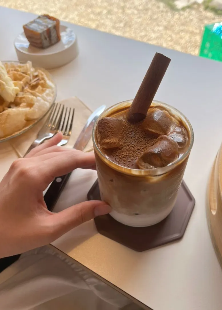 Condensed milk cinnamon latte with a cinnamon stick