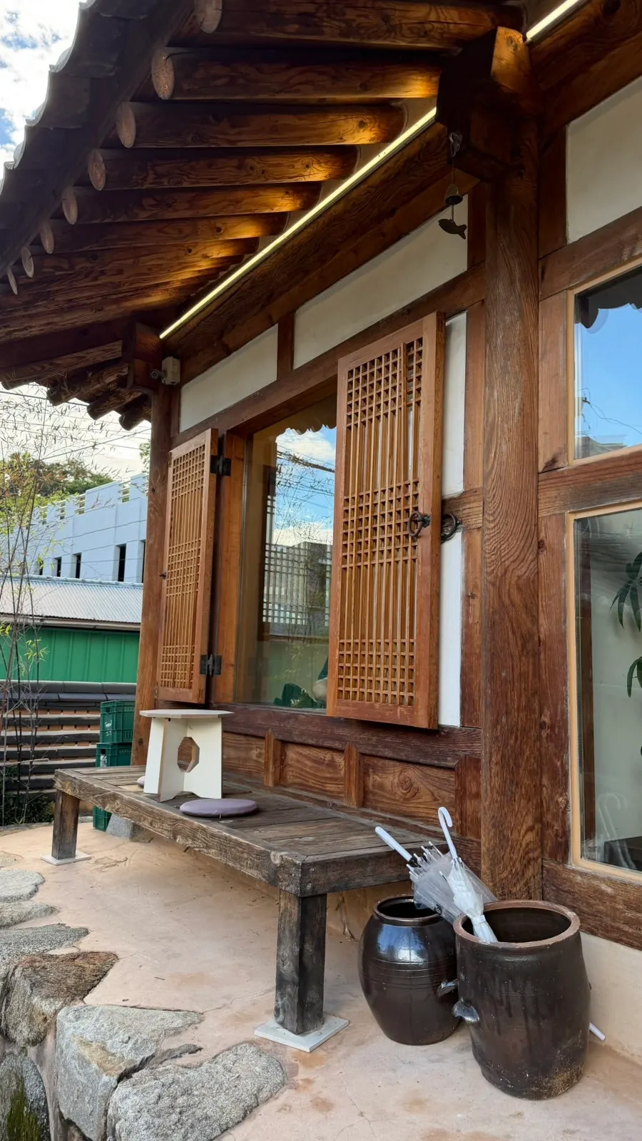 Hanok café courtyard with a tree