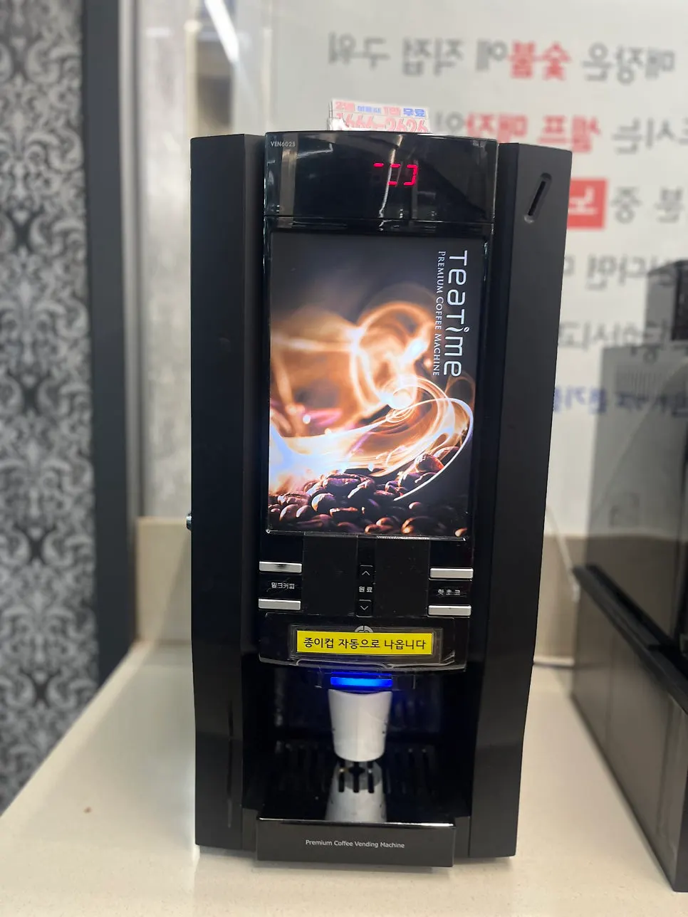 Hot chocolate and milk coffee machine set up near the exit
