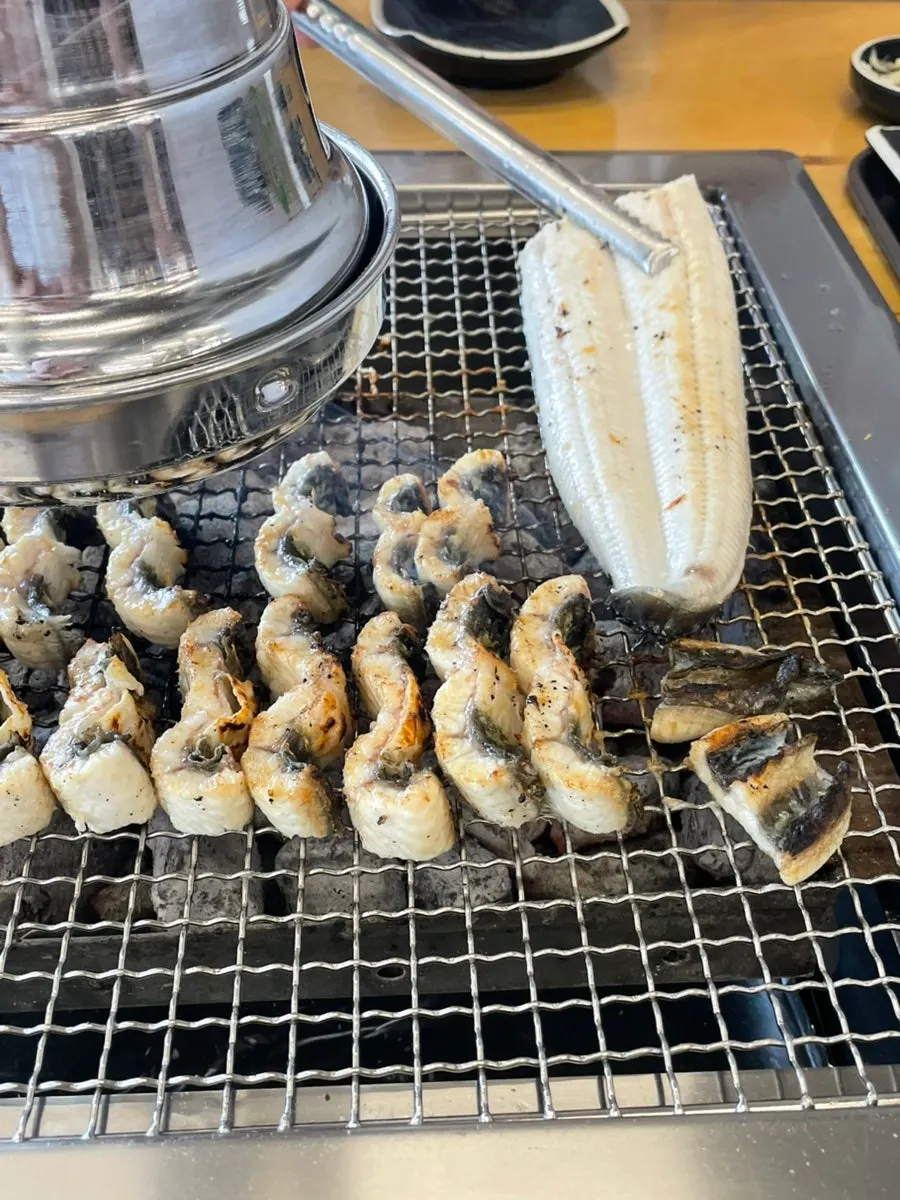 Eel grilling over charcoal