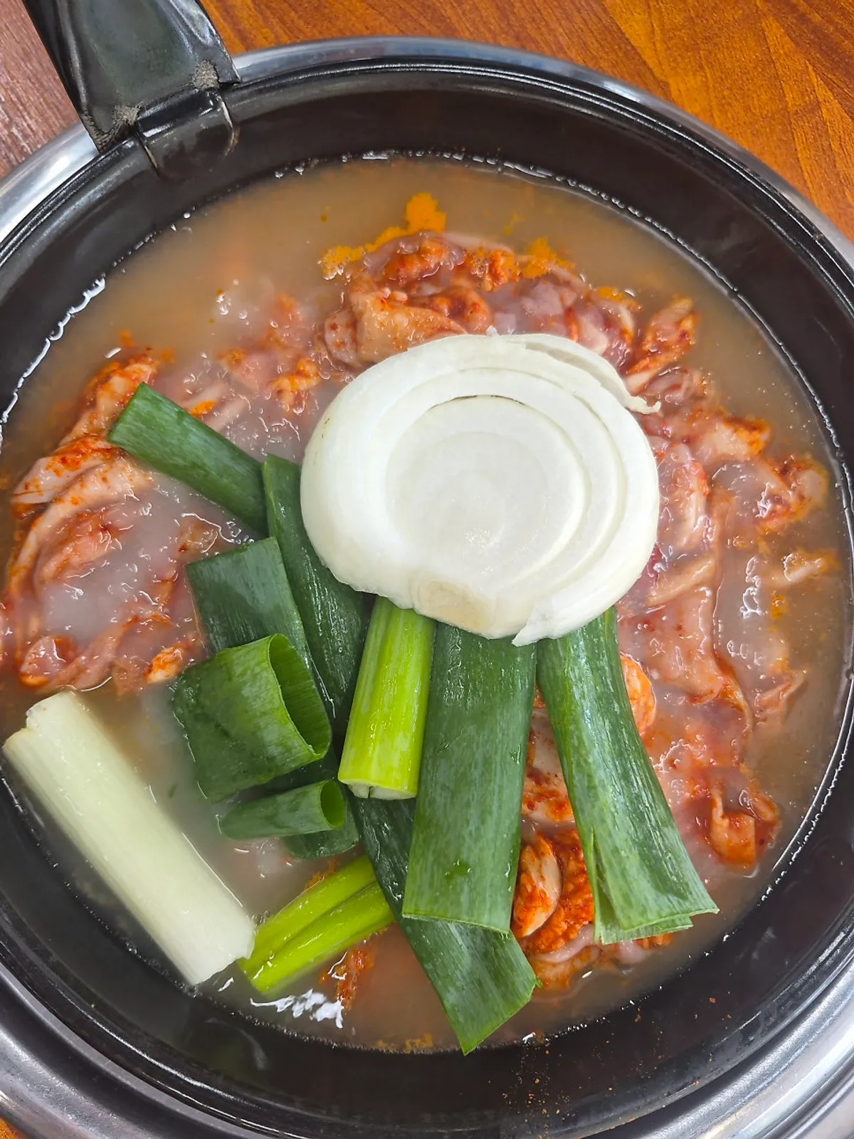 Gopchang hot pot placed on the gas burner