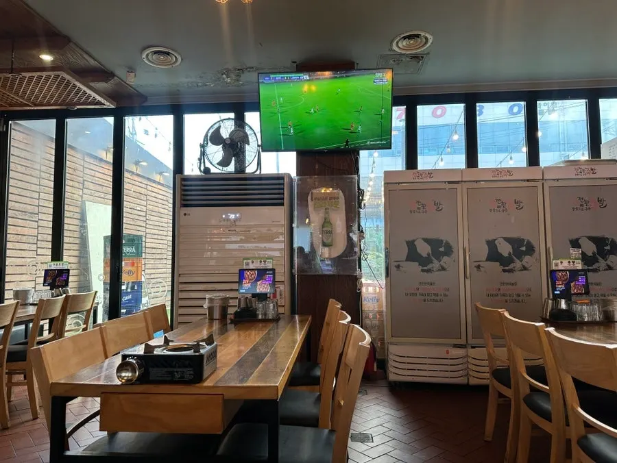 Spacious interior seating with a TV in the hall