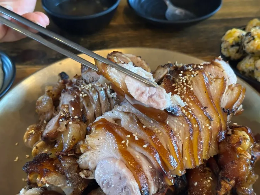 A piece of jokbal wrapped in lettuce
