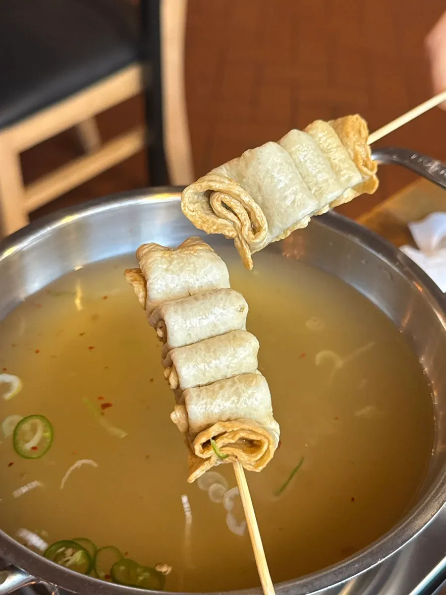The free curly fish cake soup served as a side