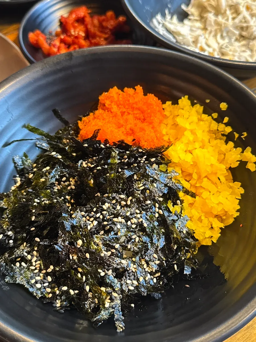Charcoal-grilled spicy jokbal with a deep sauce coating