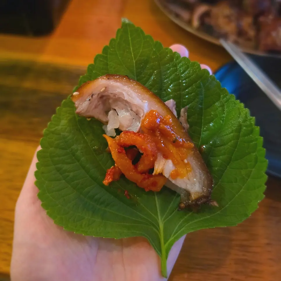Perilla leaf wrap with jokbal skin and mumallaengi on top