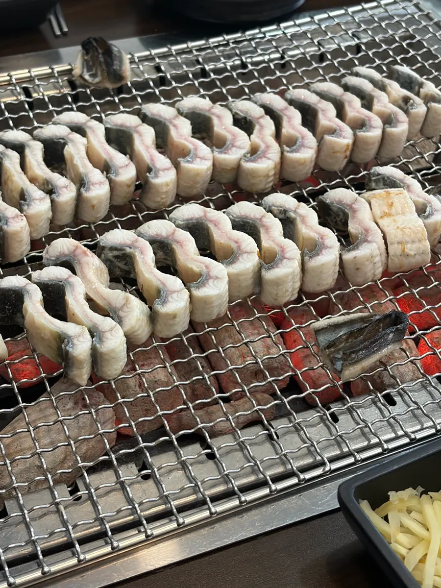 Eel grilling over charcoal