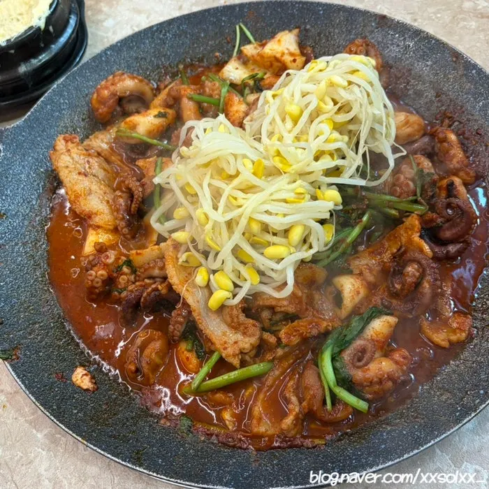 Jjukkumi and pork belly cooking on the hot plate