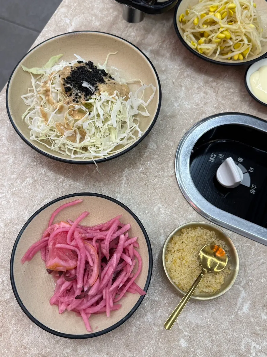 Picking up well-cooked jjukkumi and minari